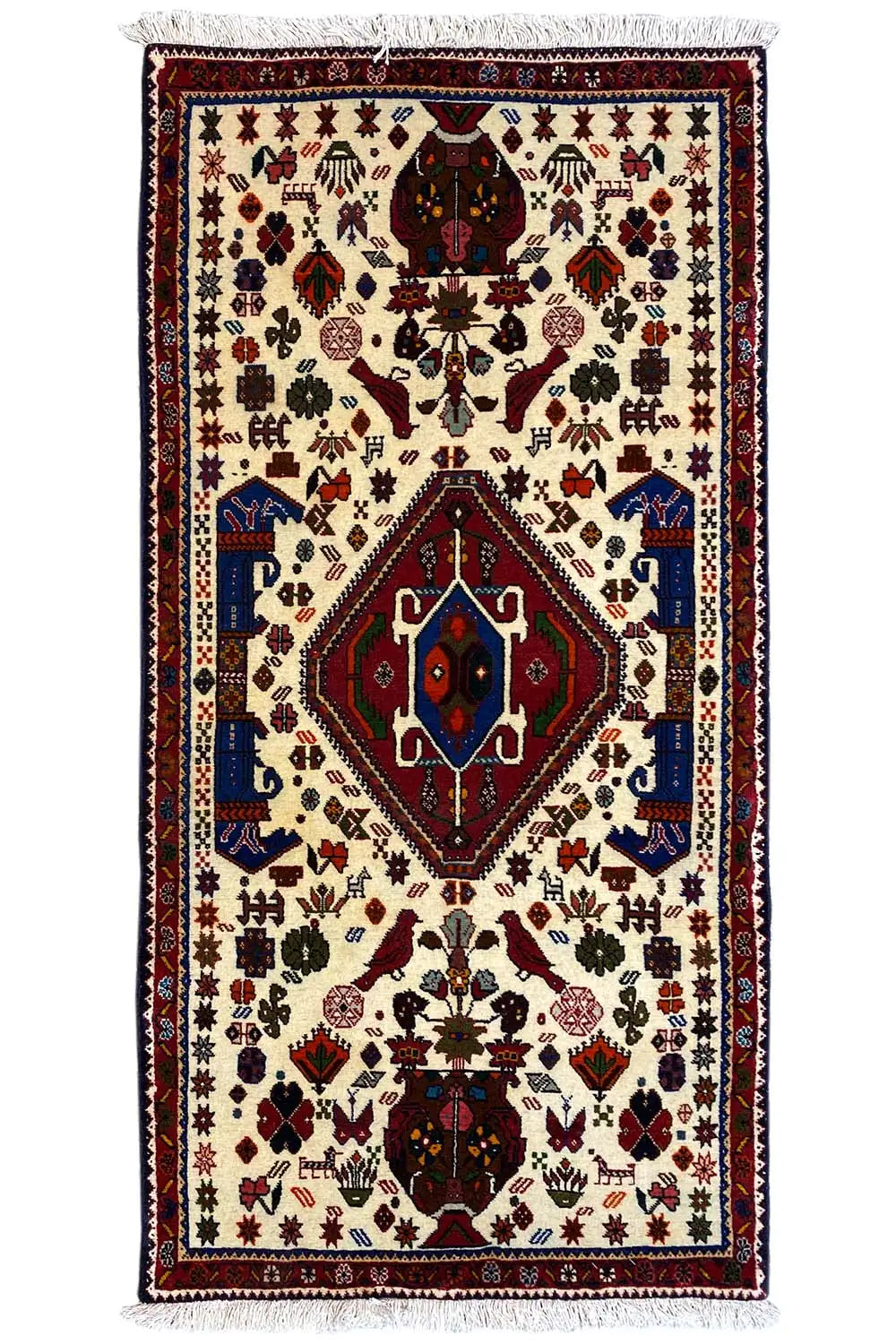 Alfombra oriental con fondo color crema, medallón rojo/azul, flecos, 153x72 cm