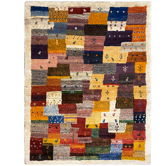 Alfombra Gabbeh Luri de 145x105 cm con estampado de bloques de patchwork en colores cálidos