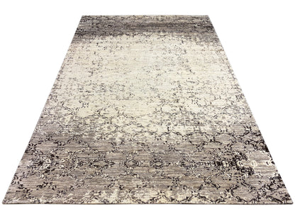 Alfombra rectangular con un diseño abstracto bicolor en beige y gris