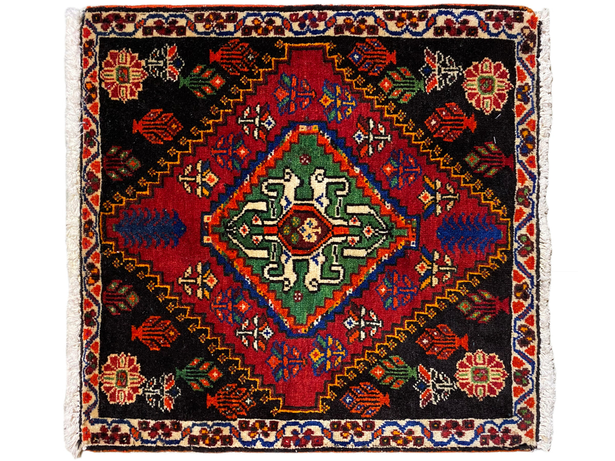 Alfombra Poshti de 56x56 cm, diseño cuadrado con campo central en verde y azul