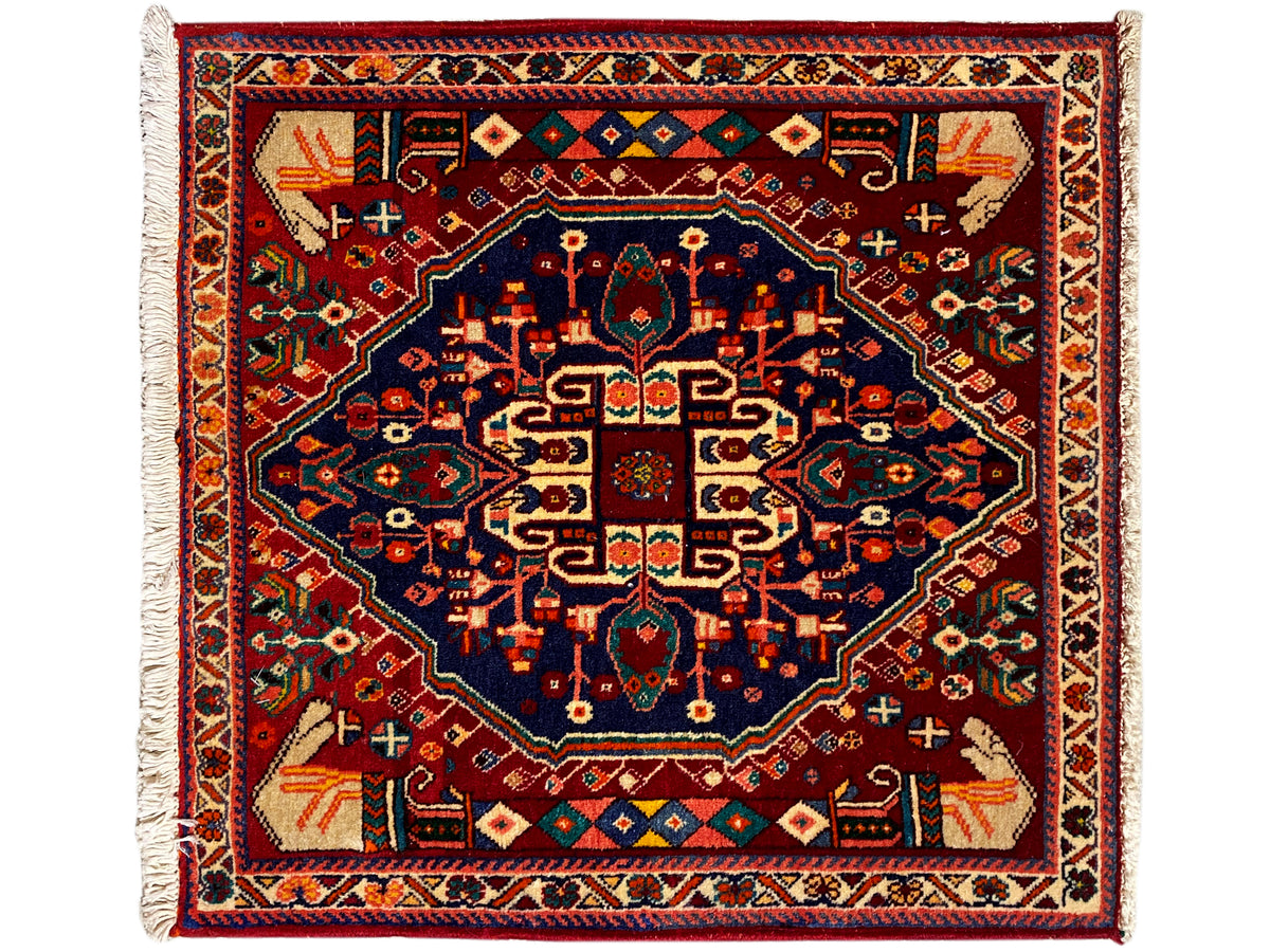 Alfombra Poshti de 64x64 cm, cuadrada, medallón central azul oscuro, adornos multicolores, flecos