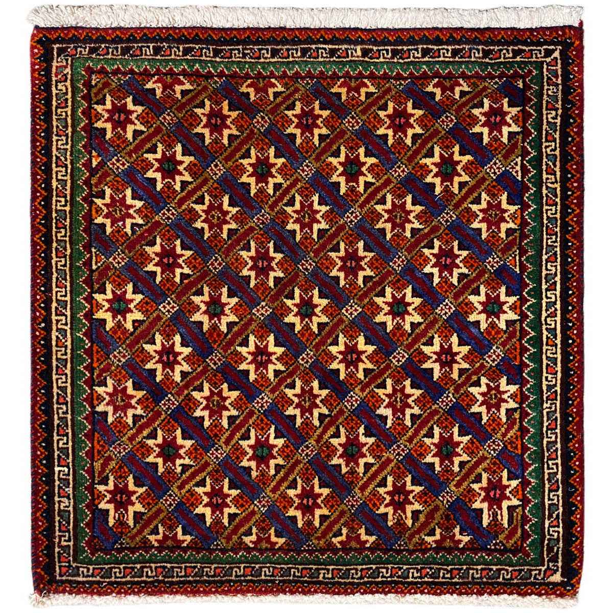 Alfombra Poshti de 62x52 cm con diseño geométrico, multicolor y flecos.