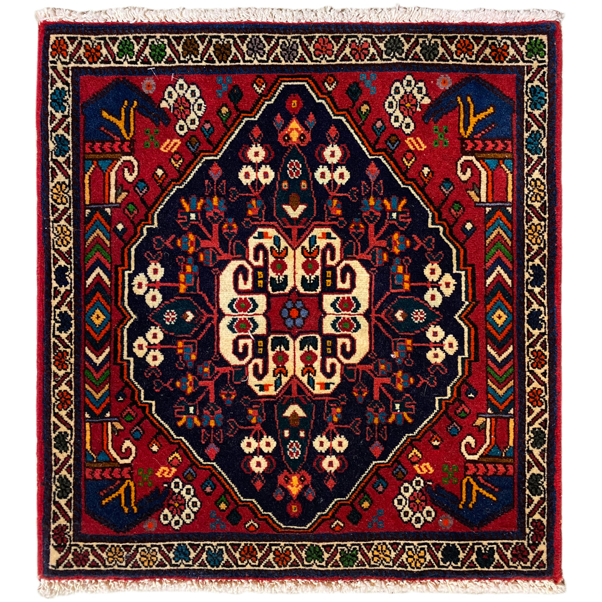 Alfombra Poshti de 66x62 cm: diseño geométrico en azul/rojo con flecos