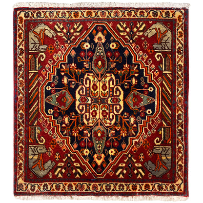 Alfombra de 65x59 cm con medallón rojo y azul, motivos ornamentales y flecos