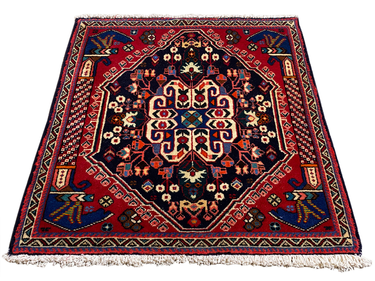Alfombra Poshti de 66x63 cm, azul oscuro/rojo, con diseño de medallón y flecos en el borde