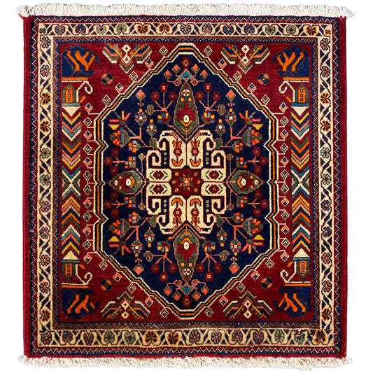 Alfombra de 63x60 cm con medallón azul y burdeos y flecos