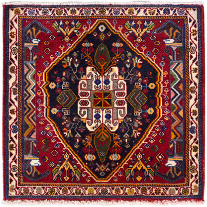 Alfombra Poshti (67×67 cm) con fondo oscuro, cenefa y medallón geométrico