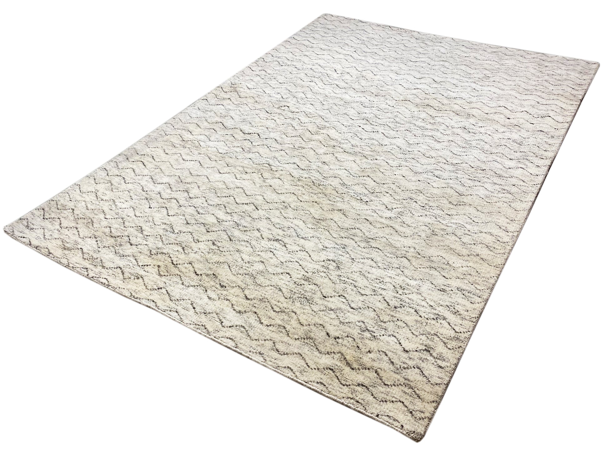 Minimalistischer Berberteppich in Naturfarben fürs Wohnzimmer